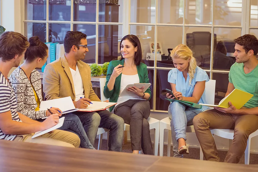 Attentive creative business people in meeting at office
